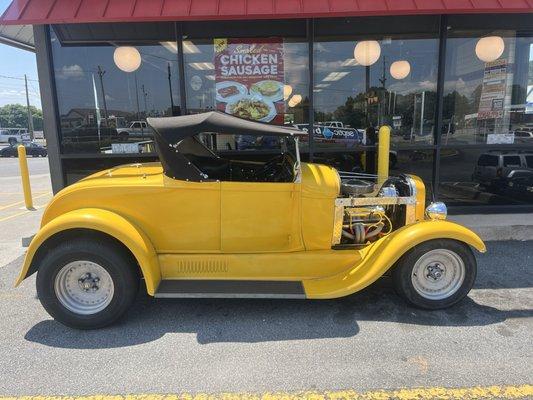 Cool car matching Waffle House colors parked in front of their store