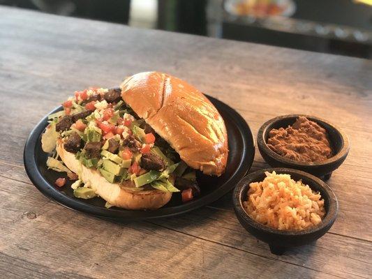 HUGE sandwich with side of rice and beans