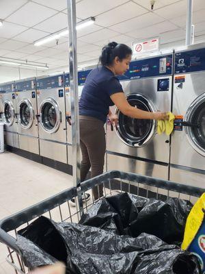 This lady keeps the laundromat clean