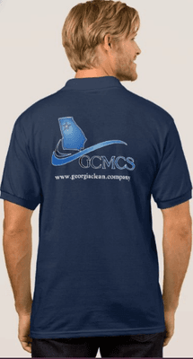 Georgia Commercial Maintenance and Cleaning Service uniform logo shirt on employee. GCMCS