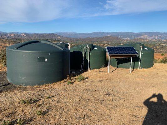 A water storage system with a solar powered booster pump.