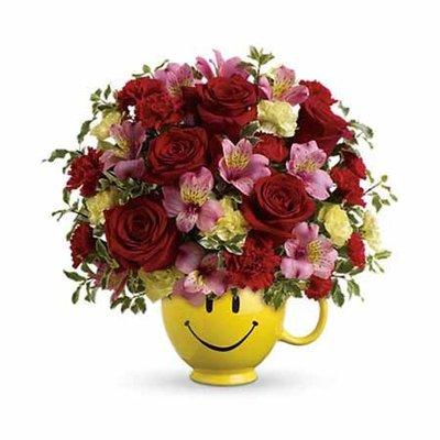 Smiles delivered daily! This effusive mix of rich red roses and pink alstroemeria, hand-delivered.