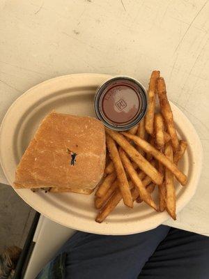 Philly cheese steak sandwich and fries.