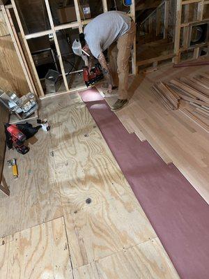 Nail in hardwood with the underlayment.