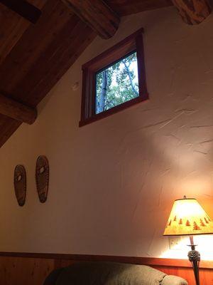 View the quaking Aspens through the high windows.