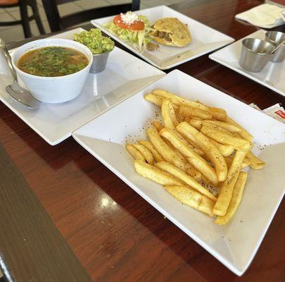 French fries, charro beans guacamole, & a picadillo gordita