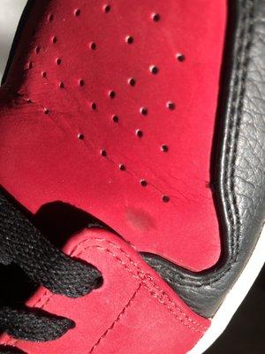 Black die in fake shoes rubbing off on the red die.