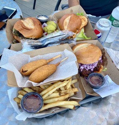 Pictured: Corn dogs, fries, the Marinated Grilled Chicken Sammich, the Chimmichurri Chicken Sammich, and the Pulled BBQ Beef Brisket.