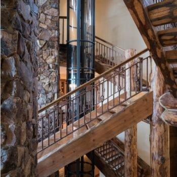 Pneumatic elevator installed in an open stairwell