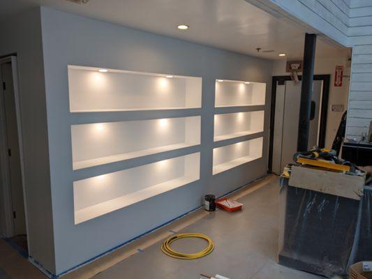 Custom shelving built and painted.