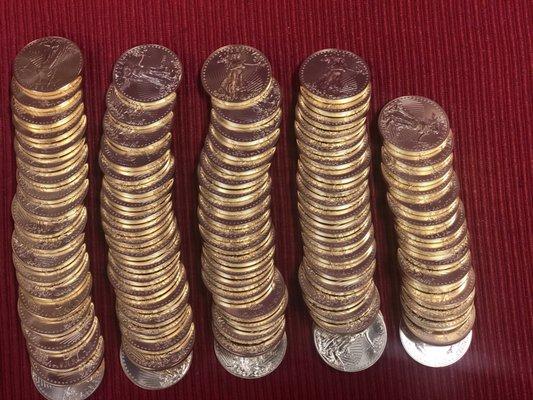 Stacks of American Gold Eagle 1 ounce coins.