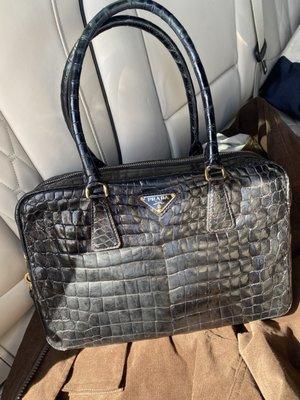 Restructured slouchy vintage alligator bag.