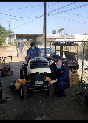 Owner Jorge & his Mechanic inspecting a Club Cadet riding mower