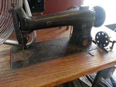 Antique sewing machine on display at Dermody Cleaners' on County Street in Taunton, MA.