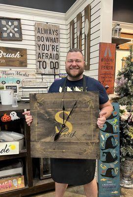 My husband and the clock he made.