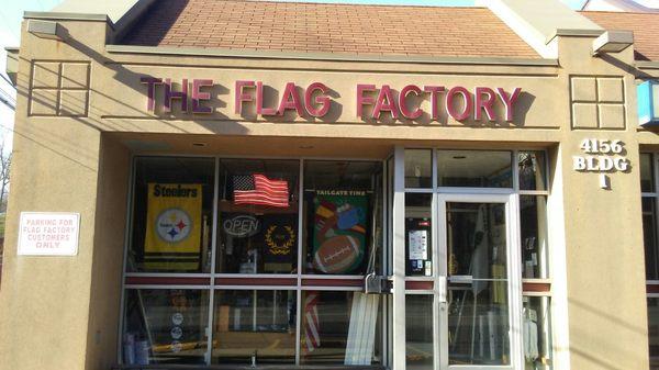 Unfortunately for me, they were closed on Sunday.  That is why the building is dark, and no flag is flying.