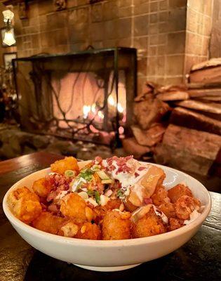 The Blunderbuss~ Cajun tots with cheddar beer fondue, bacon, sour cream and green onions