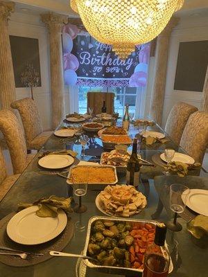 Birthday dinner - lamb, salmon, chicken, salad, Mac and cheese, mixed vegetables