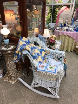 Beautiful Quilt on Wicker Rocker. Items in this room For Sale