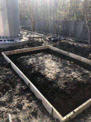 Dug footings for concrete pad