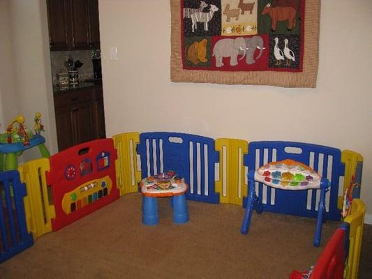 Tummy time area for infants with lots of learning activities.