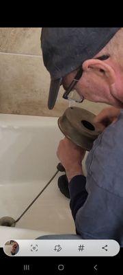 Snaking out bathtub drain