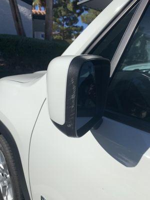 Side of mirror has paint damage that was not there.