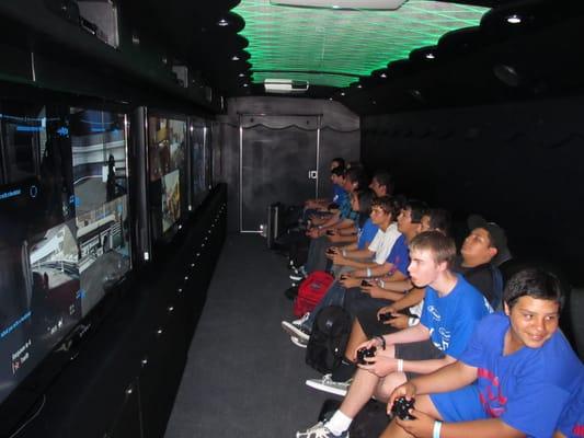 Interior pic of our game truck in action. These are high school kids getting after it. Great party for great kids.