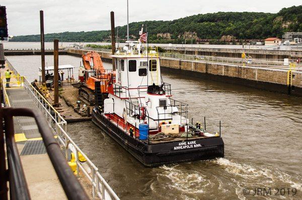 Tug enters the lock. You can watch docking operations from an elevated observation deck.