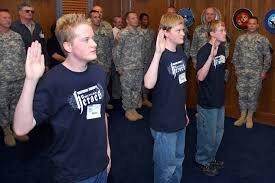 Applicants taking the Oath of Enlistment vowing to protect and serve.