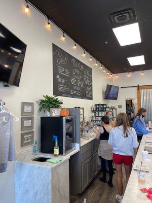 View of the menu and staff not paying attention to customers.