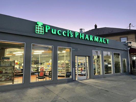 Early morning photo of the front of our store gleeming in the pre-dawn light.