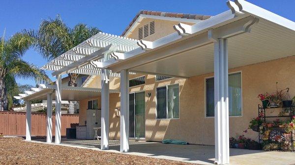 Split level Alumawood patio cover.

Raised center section is a Laguna open lattice cover.
Lower side sections are Newport open lattice.