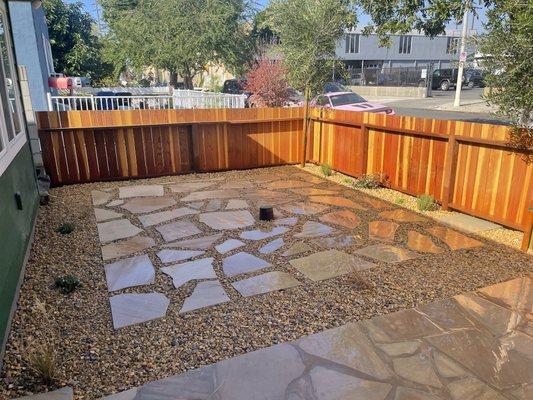 Flagstone and gravel installation.