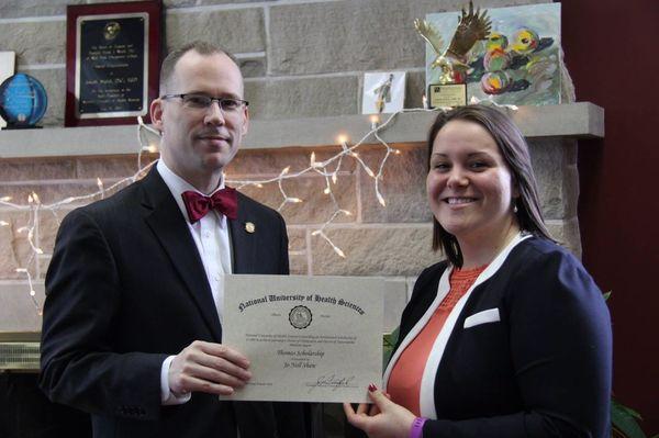 Dr. Shaw accepting an award.