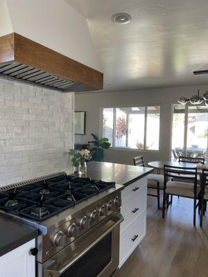 Custom tile and hood. New stove.