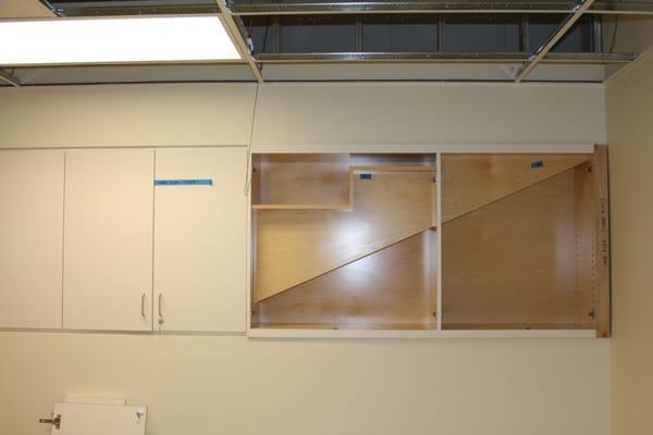 Laminated cabinet with earthquake support coved, prefinished interior.