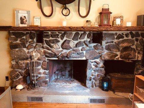 fireplace wood burning before new gas insert and German Schmear on stones.