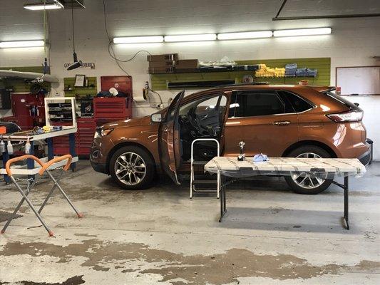 The Ford Edge in the middle of getting the glass sunroof replaced