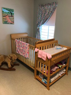 A crib and changing table in Cynthia Day Family Center for Pregnant and Parenting Women at Keystone Hall.