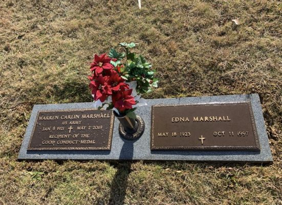 Flat Grass memorial. Bronze memorial plaques with granite base. Shown with Bronze Flower vase.