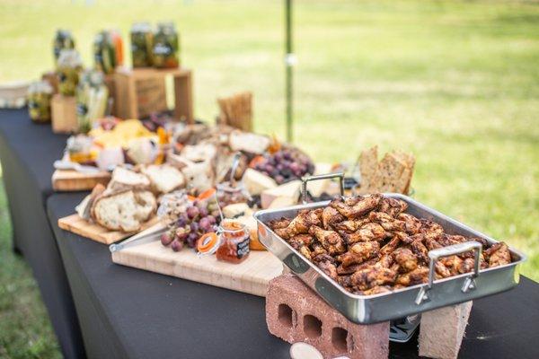 Pickle bar, local cheeses and crispy grilled wings for a reception.