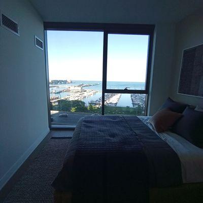 A bedroom with views of lake