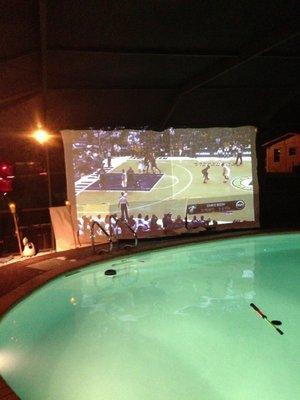 NBA Playoffs watch-party poolside in a backyard