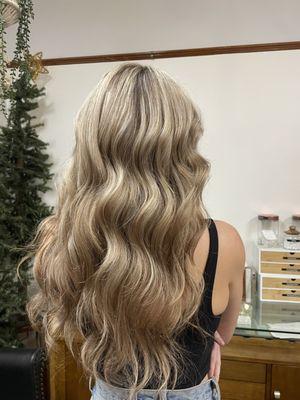 This is a full blonding session to add brightness to her hair.