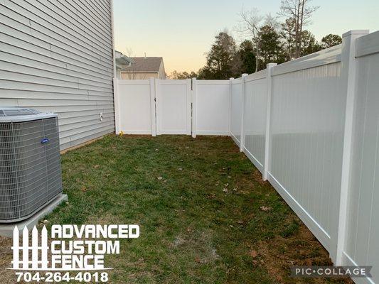 white vinyl fence