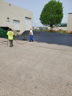 Sealcoating a parking lot