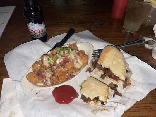 Philly cheesesteak and loaded tots.