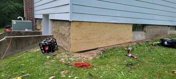 Taking a crumbling wall and adding framing and siding