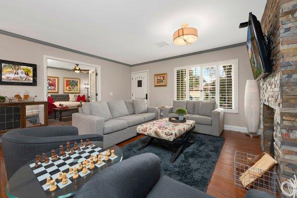 Interior living space redefined with new stacked stone fireplace face, French doors to den and new entry door. Amazing transformation.